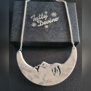 Tatty Devine Limited Edition Marble Moon acrylic necklace.
